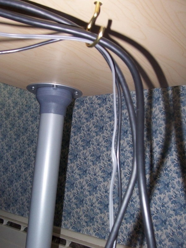 Attach a Small Hook Underneath Your Desk to Keep Cords out of The Way. 