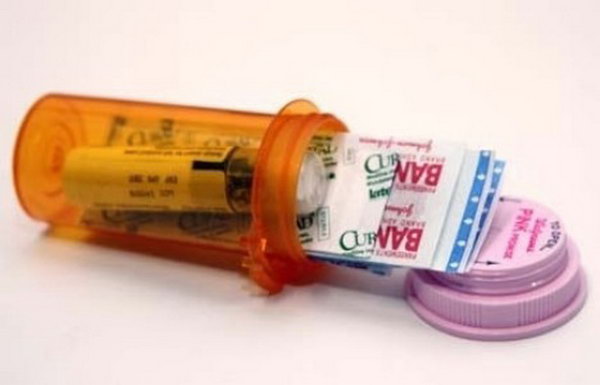 DIY Mini First-aid Kit Using a Prescription Bottle. See more details 