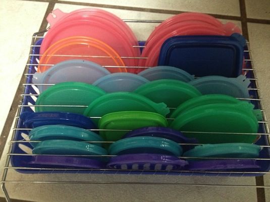 Cooling Rack Over a Dollar Store Basket to Organize Plastic Lids. 