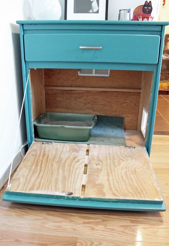Turn an Old Dresser Into a Cabinet For The Litter Box. 