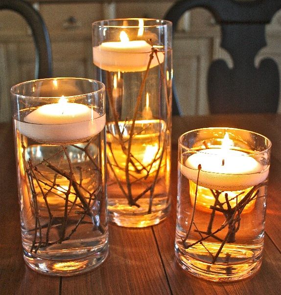 Floating Candle Centerpieces with Twigs.Dress up your table with a simple, easy, and inexpensive floating candle centerpiece! Tutorial via 