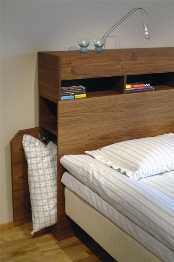 It's a clever idea to use your headboard for extra storage space.