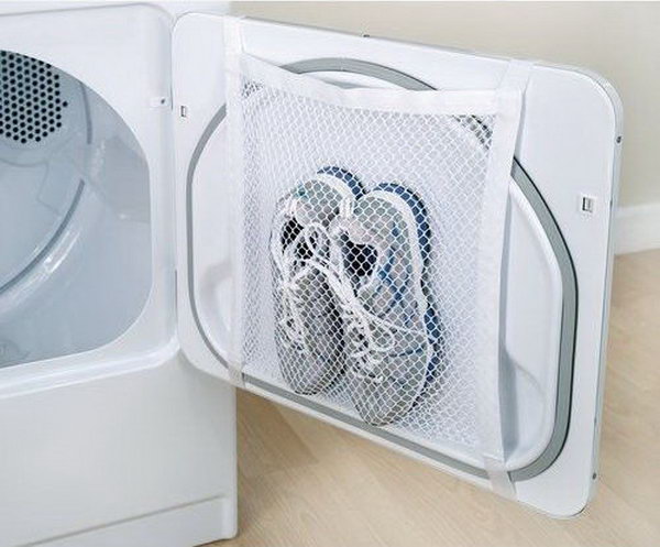 Tape a laundry bag to the inside of your tumble dryer door for easy drying of sports shoes