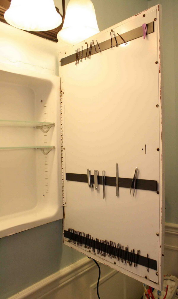 Use a magnetic strip to store bobby pins behind a cabinet door.