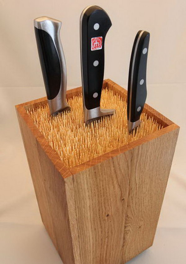 Fill an old box with skewers to make an universal knife block. 