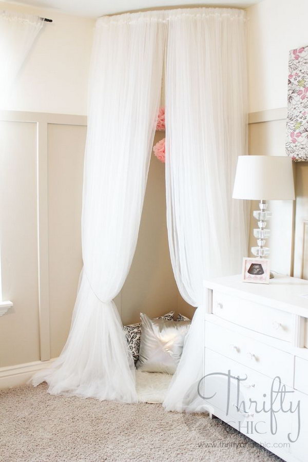 Make a Cute Reading Nook out of Curved Curtain Rod and $4 Ikea Curtains . 