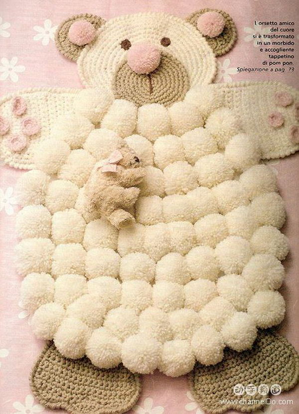 DIY Simple Crocheted Finger Pom-poms Bear Rug. This will be the perfect addition to any nursery and make a wonderful way to add a little pop to your space.  