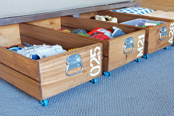 DIY Rolling Storage Crates. The crates were surprisingly easy to make and relatively inexpensive. They roll out on casters and maximize the storage space under the bed. Learn how to make these crates 