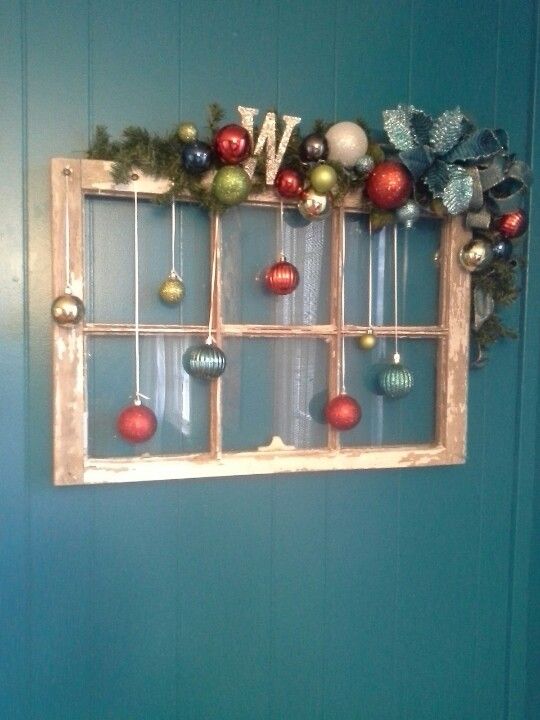 Old Window with Hanging Ornaments in Each Pane for Christmas Decor. 