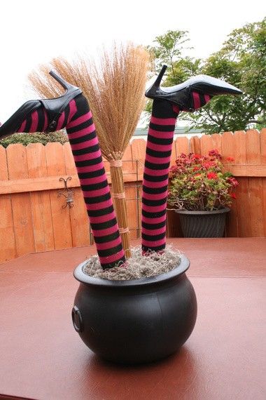 DIY Witch Legs from Pool Noodles and Dollar Store Stockings. 